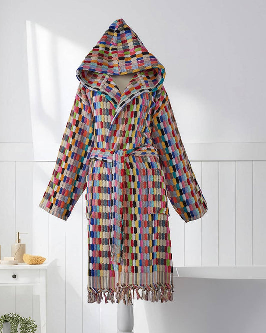 Colorful checkered bathrobe on a stand in a bathroom setting