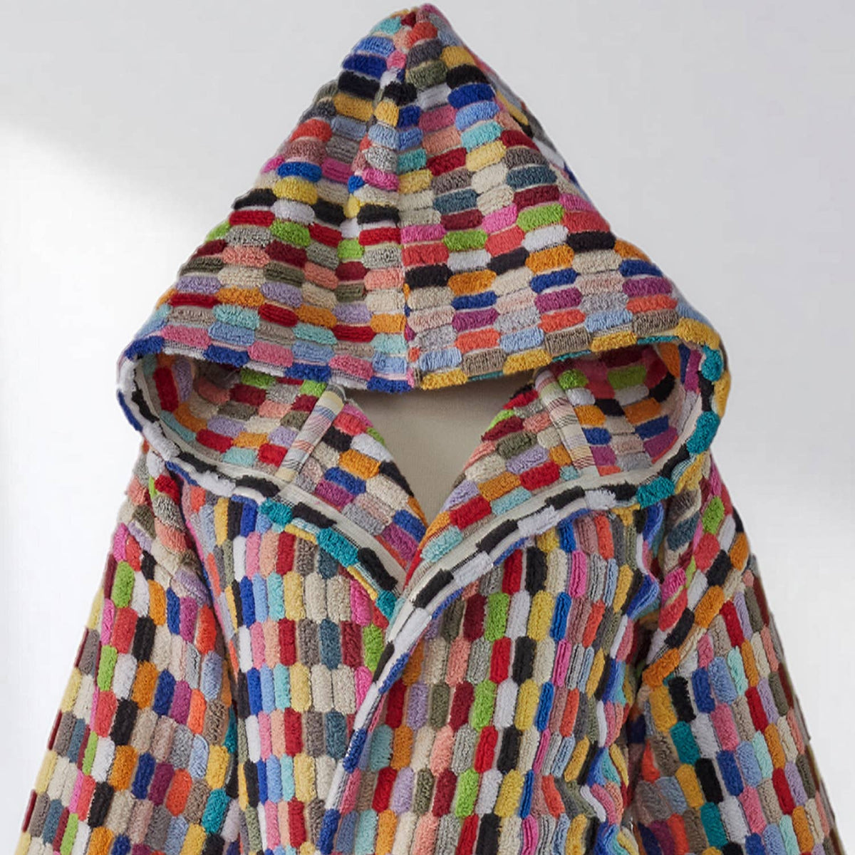 Multicolored textured robe with hood on a white background