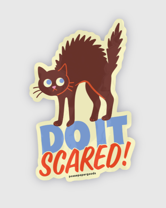 Sticker of a cat with 'DO IT SCARED!' text on a light gray background